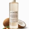 Aceite post depilatorio Koken 500ml con aceite de argán y aroma de coco en botella transparente sobre fondo blanco con cocos y nueces de argán