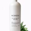 Gel post depilatorio aloe vera Koken 1 litro en botella blanca grande con dosificador sobre fondo blanco con planta de aloe vera — formato profesional para centros de estética